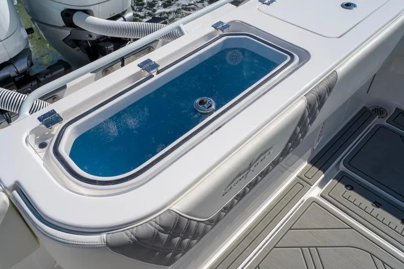 Slide: The Image of 2025 Invincible 33 Open Fisherman boat with livewell and dual outboard engines. - 41
