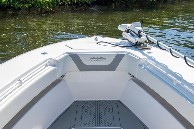 Slide: The Image of 2025 Invincible 33 Open Fisherman boat, featuring sleek design and advanced equipment on calm waters. - 45