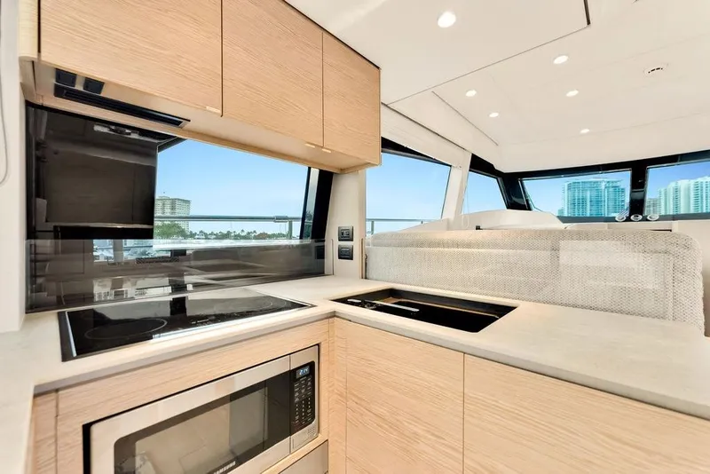 Slide: The Image of Modern kitchen interior of 2021 Ferretti Yachts 500 with sleek appliances and panoramic windows. - 47