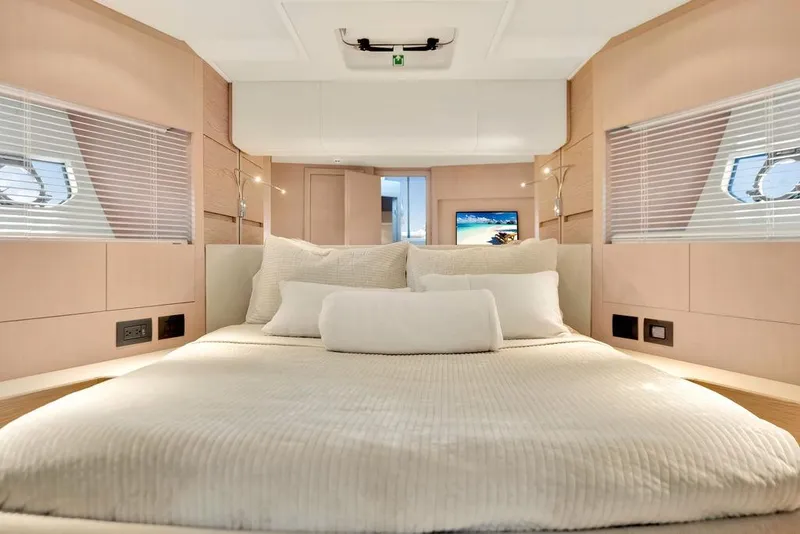 Slide: The Image of Luxurious bedroom interior of 2021 Ferretti Yachts 500 with modern design and cozy bedding. - 73