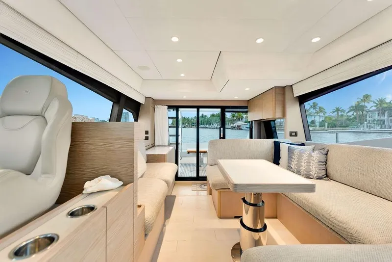 Slide: The Image of Luxurious interior of 2021 Ferretti Yachts 500 with elegant seating and scenic views. - 52