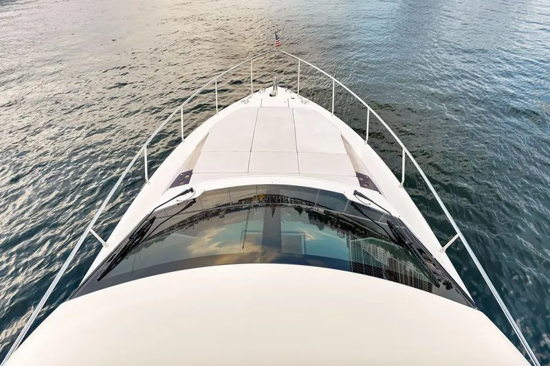 Slide: The Image of Ferretti Yachts 500, 2021 model, cruising on calm waters, viewed from the bow. - 40