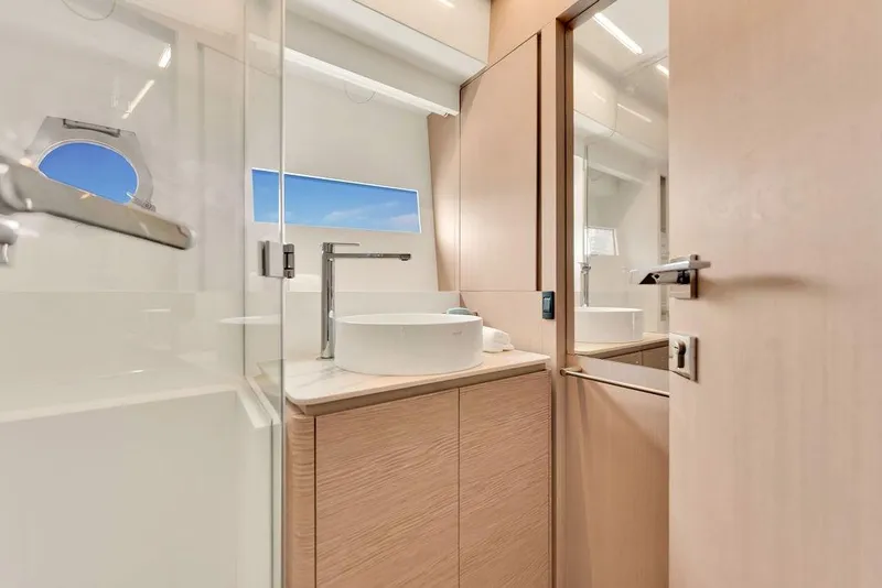 Slide: The Image of Luxurious bathroom interior of 2021 Ferretti Yachts 500 with modern fixtures and natural light. - 70