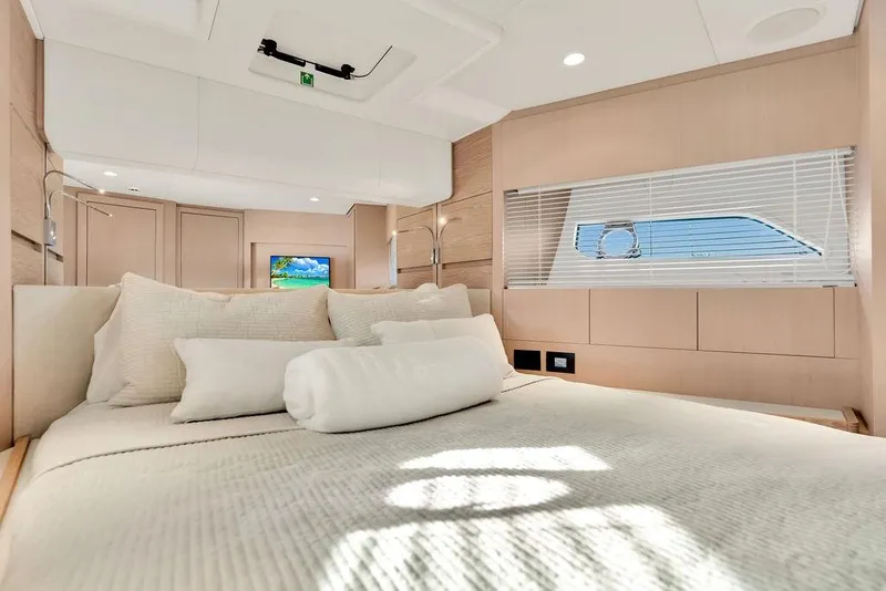 Slide: The Image of Luxurious bedroom interior of 2021 Ferretti Yachts 500 with modern design and natural light. - 74