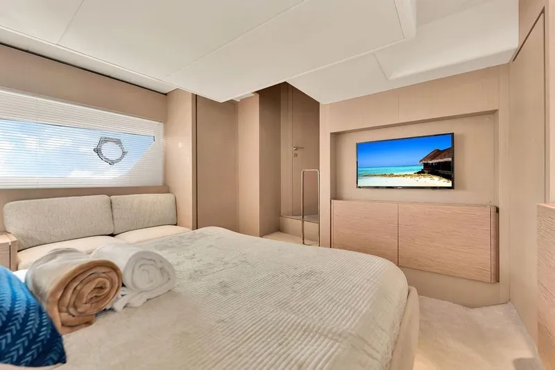 Slide: The Image of Luxurious bedroom interior of 2021 Ferretti Yachts 500 with modern decor and ocean view. - 60