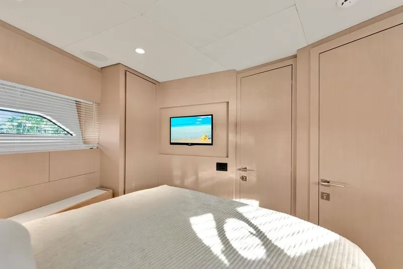 Slide: The Image of Luxurious bedroom interior of 2021 Ferretti Yachts 500, featuring modern design and natural light. - 77