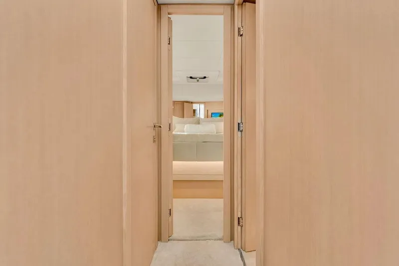 Slide: The Image of Interior hallway of 2021 Ferretti Yachts 500, leading to a luxurious bedroom. - 71