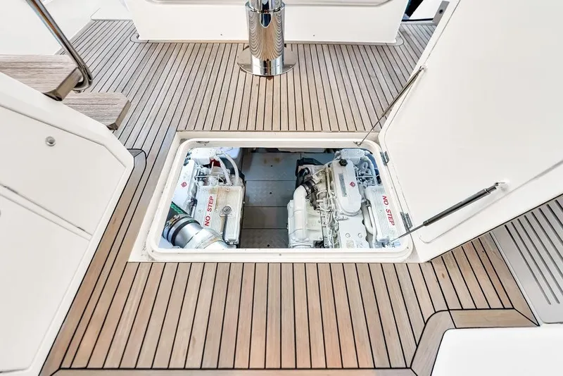 Slide: The Image of Engine compartment of 2021 Ferretti Yachts 500, showcasing sleek wooden deck design. - 85