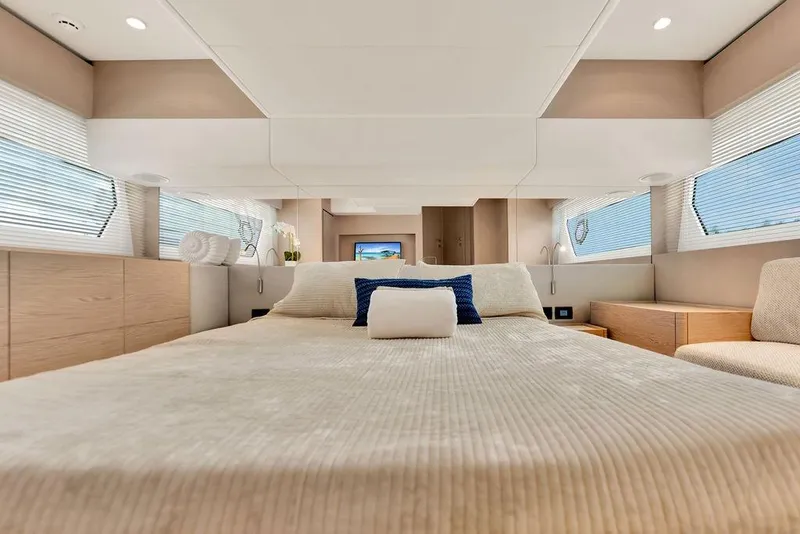 Slide: The Image of Luxurious bedroom interior of 2021 Ferretti Yachts 500, featuring elegant design and natural light. - 65