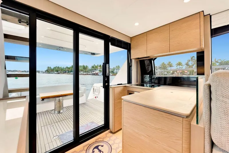 Slide: The Image of Luxurious interior of 2021 Ferretti Yachts 500 with modern kitchen and scenic ocean view. - 43