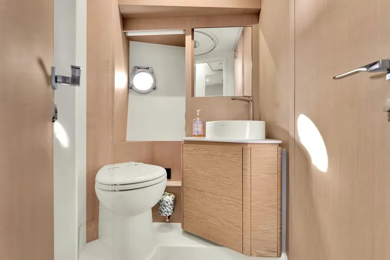Slide: The Image of Modern bathroom interior on 2021 Ferretti Yachts 500, featuring sleek design and wooden cabinetry. - 80
