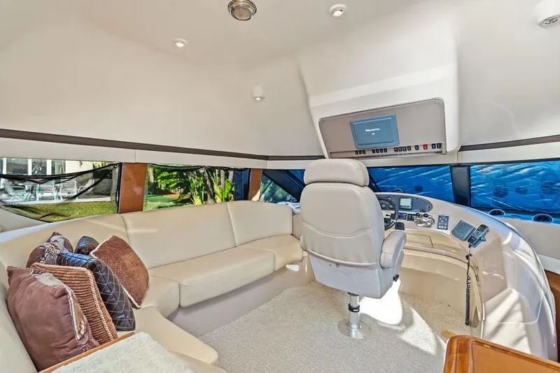 Slide: The Image of Luxurious interior of 2009 Carver 56 Voyager SE yacht with plush seating and helm. - 21