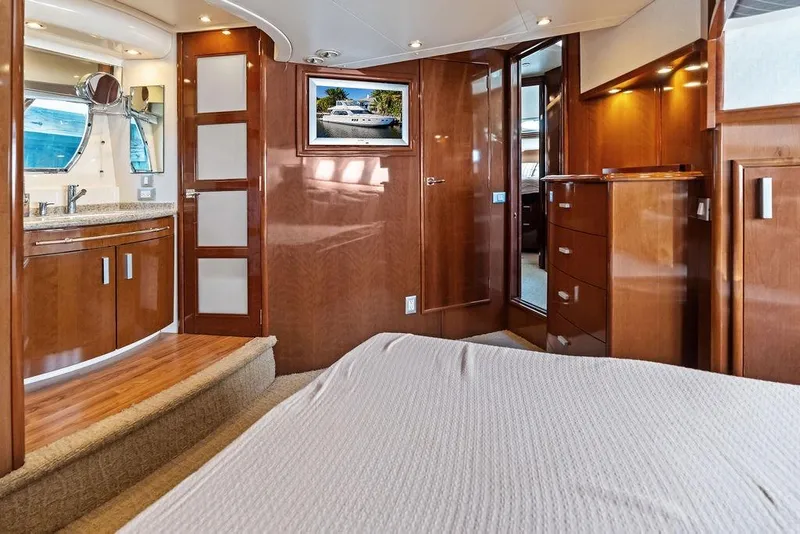 Slide: The Image of Luxurious interior of 2009 Carver 56 Voyager SE yacht with wood finishes and modern amenities. - 27