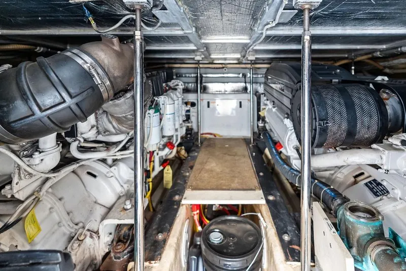 Slide: The Image of Engine room of 2009 Carver 56 Voyager SE yacht, showcasing mechanical components and systems. - 45