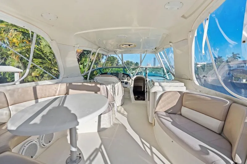 Slide: The Image of Luxurious interior of 2009 Carver 56 Voyager SE yacht with spacious seating and panoramic windows. - 38