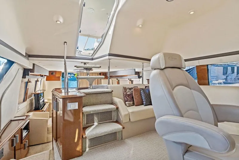 Slide: The Image of Luxurious interior of 2009 Carver 56 Voyager SE yacht with plush seating and elegant design. - 23