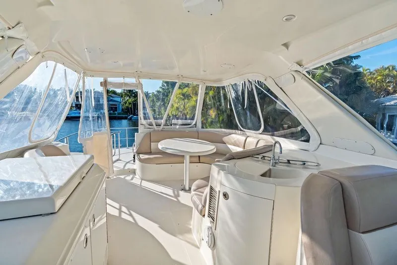 Slide: The Image of Luxurious interior of 2009 Carver 56 Voyager SE yacht with seating and kitchenette. - 37