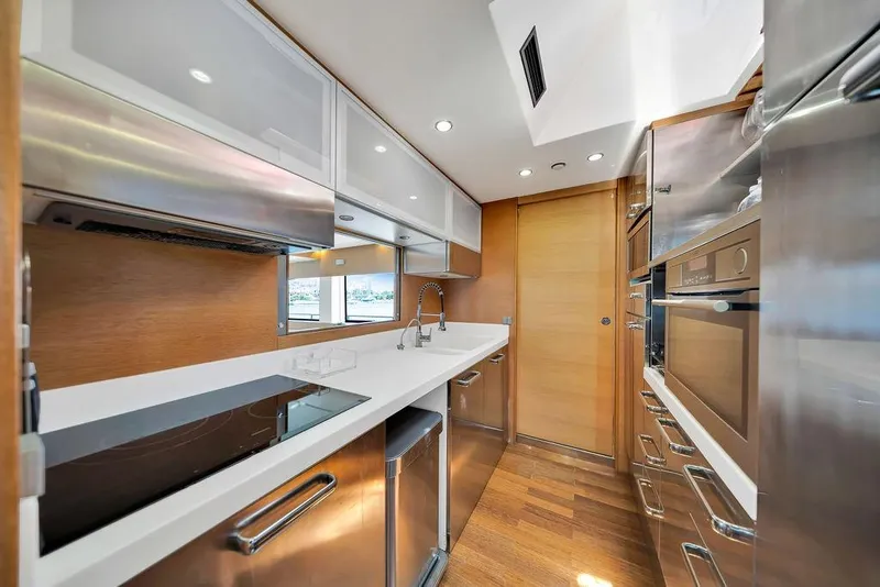 Slide: The Image of Modern kitchen interior on 2008 Aicon 75 yacht, featuring sleek appliances and wood accents. - 67