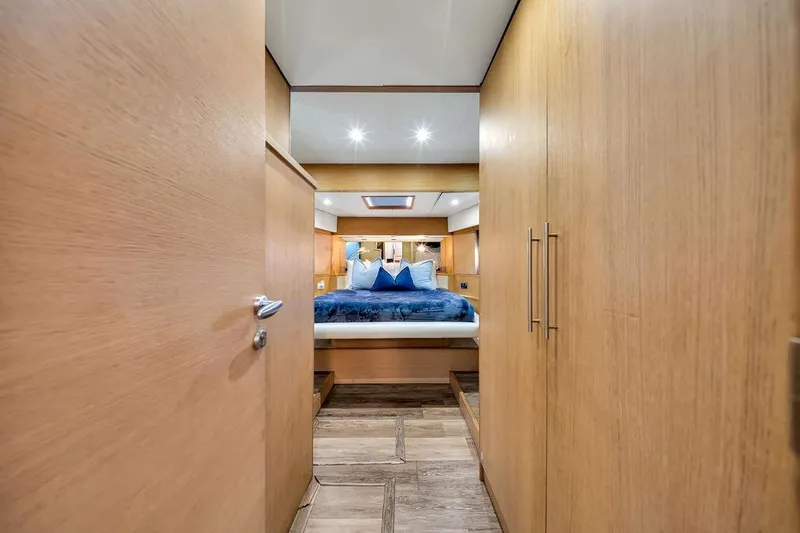 Slide: The Image of Luxurious bedroom interior of 2008 Aicon 75 yacht with wooden finishes and elegant bedding. - 94