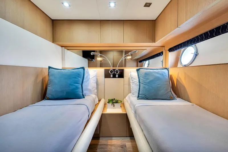 Slide: The Image of Luxurious twin cabin interior of 2008 Aicon 75 yacht with modern decor and soft lighting. - 76