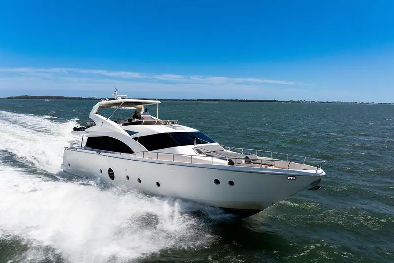 The Image of Luxury Aicon 75 yacht cruising on open water under clear blue skies, 2008 model. - 0