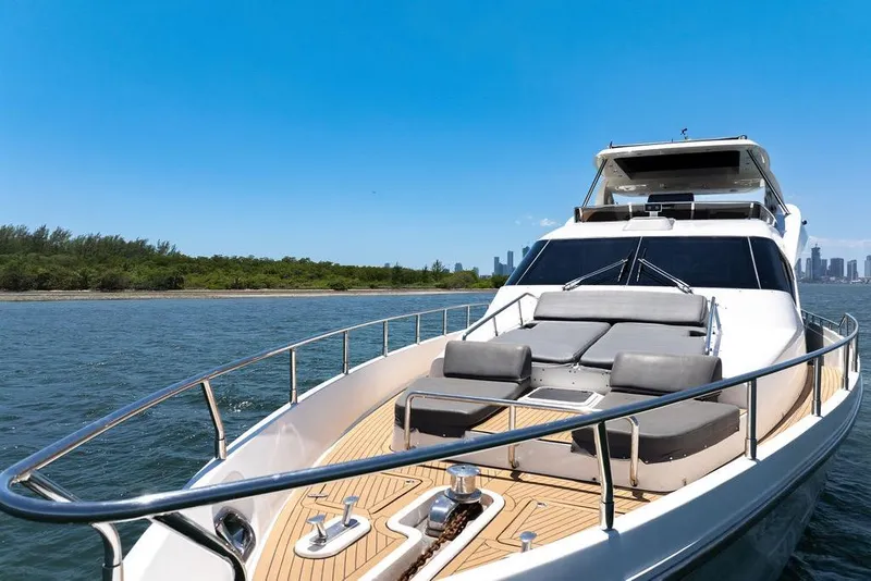 Slide: The Image of Luxury Aicon 75 yacht cruising near coastline, 2008 model, with spacious deck and modern design. - 13