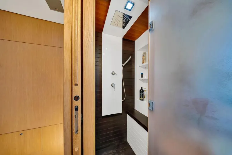 Slide: The Image of Luxurious shower area in 2008 Aicon 75 yacht, featuring modern fixtures and wooden accents. - 90