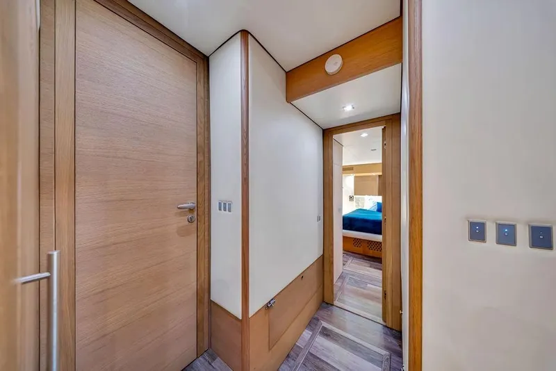 Slide: The Image of Interior hallway of 2008 Aicon 75 yacht, featuring wooden doors and modern design. - 101