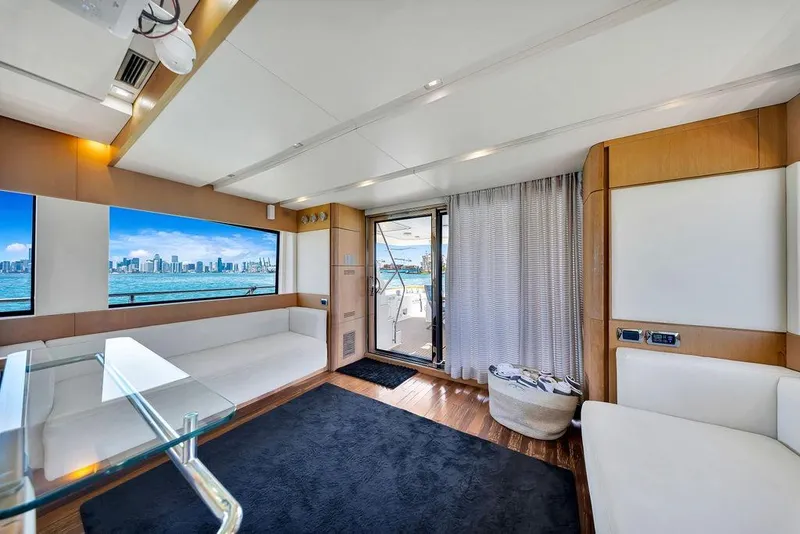 Slide: The Image of Luxurious interior of 2008 Aicon 75 yacht with city skyline view through large windows. - 46
