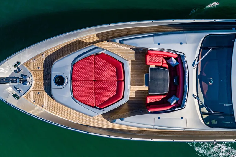 Slide: The Image of Aerial view of 2008 Pershing 90 yacht with red seating and wooden deck. - 14