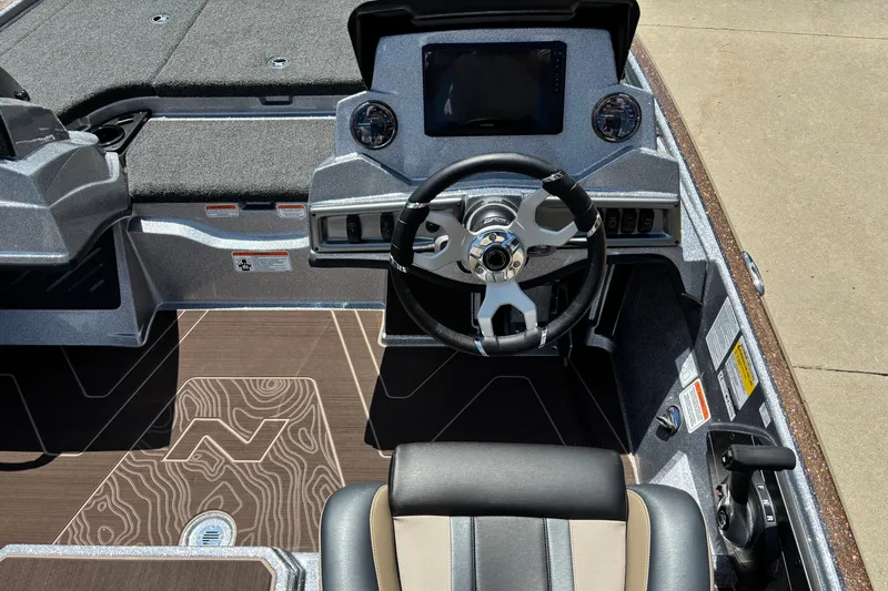 Slide: The Image of 2027 Nitro Z19 XL Pro boat cockpit with modern steering and dashboard controls. - 7