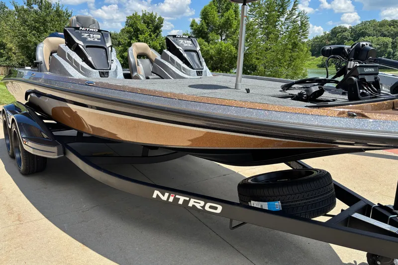 Slide: The Image of 2027 Nitro Z19 XL Pro boat on trailer, parked outdoors under blue sky. - 4