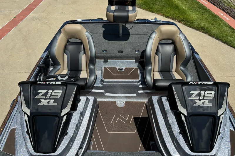Slide: The Image of 2027 Nitro Z19 XL Pro boat interior with dual seats and sleek design. - 6