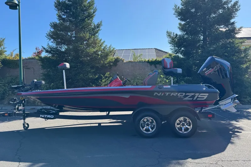 The Image of 2027 Nitro Z19 XL Pro boat on trailer, parked outdoors. - 0