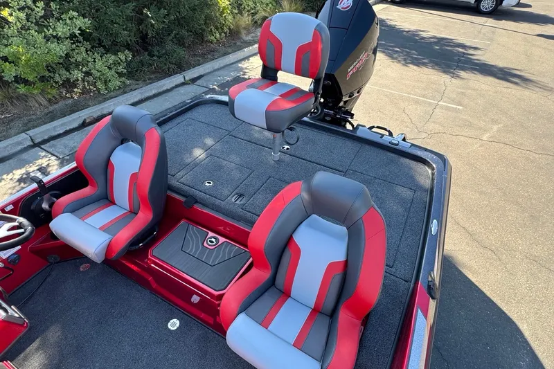 Slide: The Image of 2027 Nitro Z19 XL Pro boat interior with red and gray seating. - 13