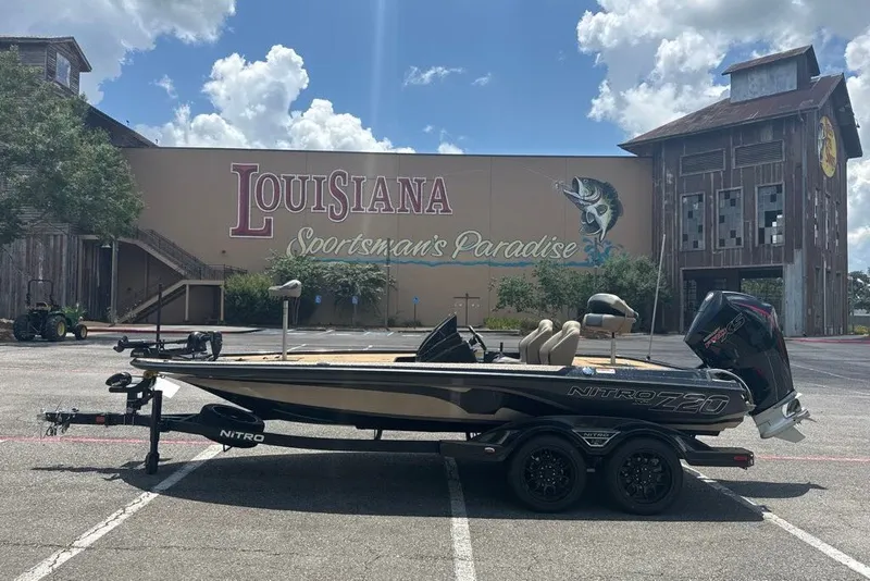 Slide: The Image of 2027 Nitro Z20 XL boat parked at Louisiana Sportsman's Paradise under a blue sky. - 2