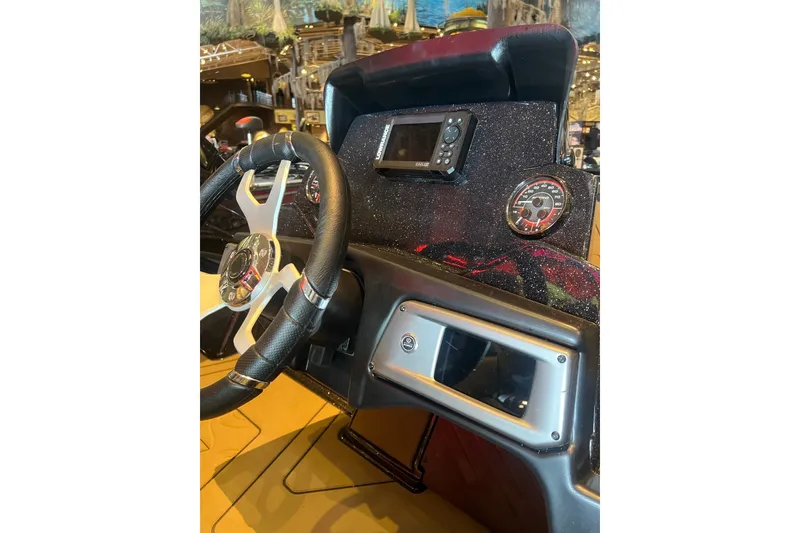 Slide: The Image of Dashboard of a 2027 Nitro Z20 XL boat with steering wheel and gauges. - 13