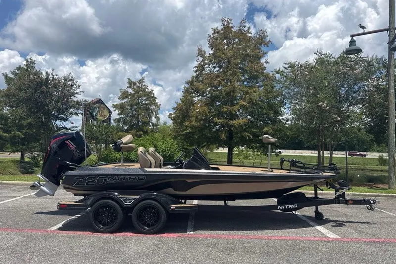 The Image of 2027 Nitro Z20 XL boat parked outdoors under a cloudy sky. - 0