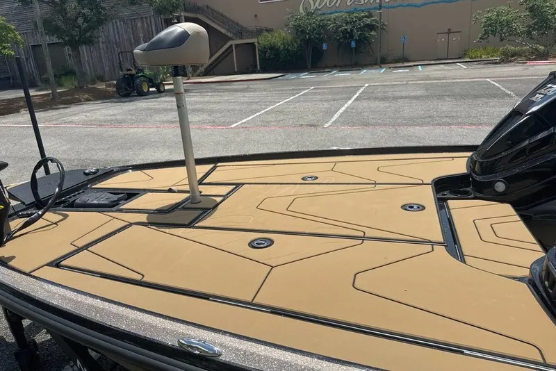 Slide: The Image of 2027 Nitro Z20 XL boat with tan deck in a parking lot. - 5
