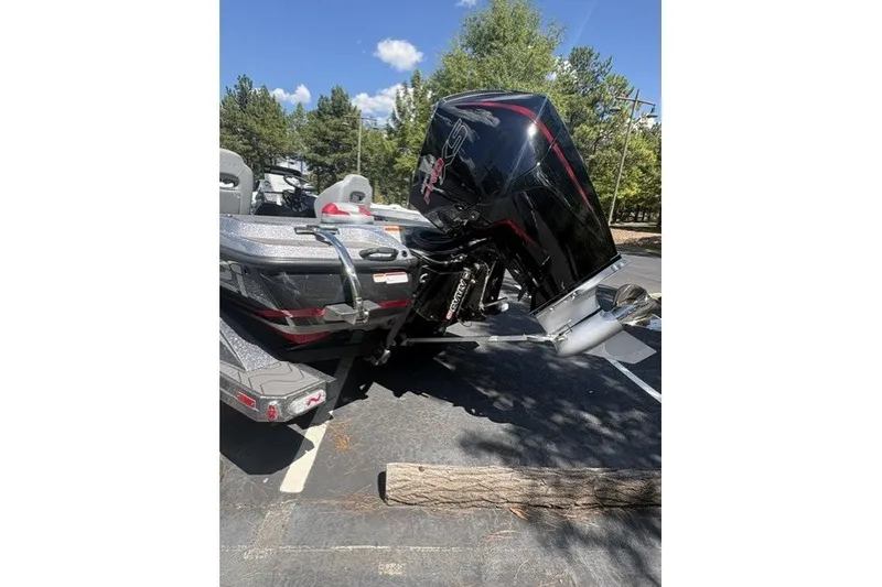 Slide: The Image of 2027 Nitro Z21 XL Pro boat with powerful engine in a parking lot. - 5