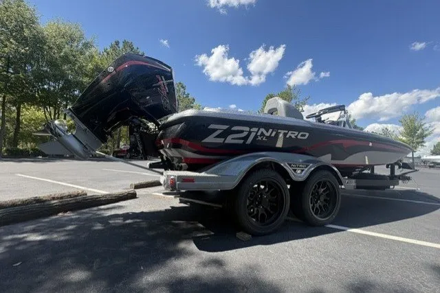 Slide: The Image of 2027 Nitro Z21 XL Pro boat on trailer under clear blue sky. - 4