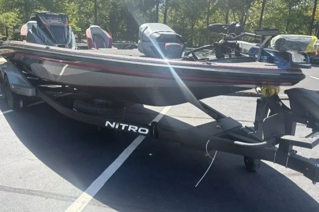 Slide: The Image of 2027 Nitro Z21 XL Pro boat on trailer in parking lot. - 2