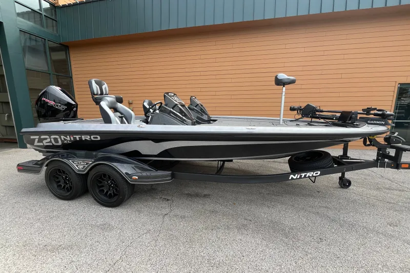 Slide: The Image of 2027 Nitro Z20 XL Pro fishing boat with dual consoles and trailer. - 1