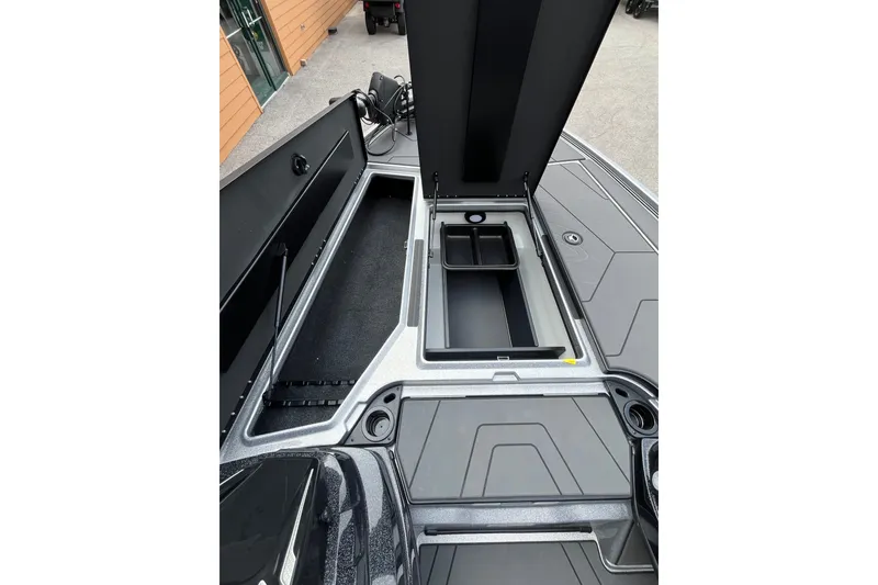Slide: The Image of 2027 Nitro Z20 XL Pro boat storage compartments with open lids, showcasing spacious interior design. - 9