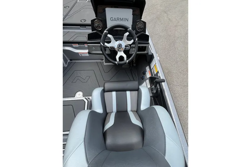 Slide: The Image of 2027 Nitro Z20 XL Pro boat cockpit with Garmin navigation and sleek seating. - 4