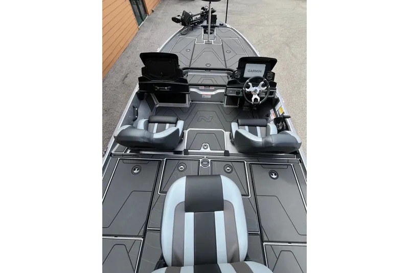 Slide: The Image of 2027 Nitro Z20 XL Pro boat interior with sleek seating and advanced Garmin navigation system. - 2