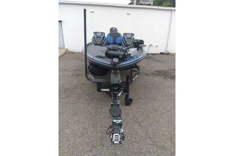 Slide: The Image of 2027 Nitro Z21 XL Pro fishing boat on trailer, parked outdoors. - 6