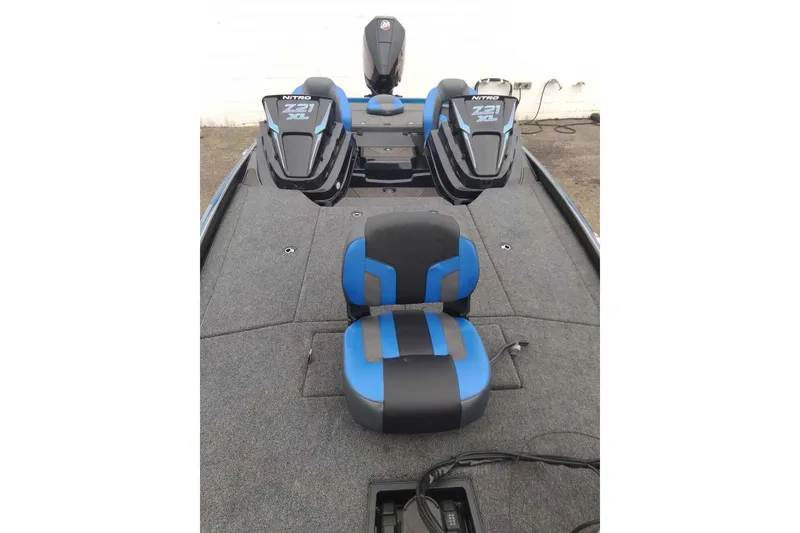 Slide: The Image of 2027 Nitro Z21 XL Pro boat interior with blue and black seating. - 7
