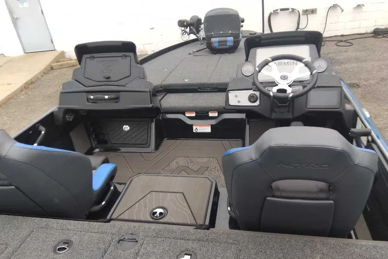 Slide: The Image of 2027 Nitro Z21 XL Pro boat interior with steering wheel and seating. - 20