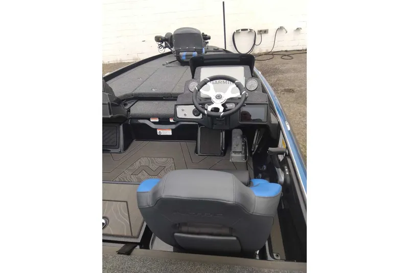 Slide: The Image of 2027 Nitro Z21 XL Pro boat interior with steering wheel and seating. - 3